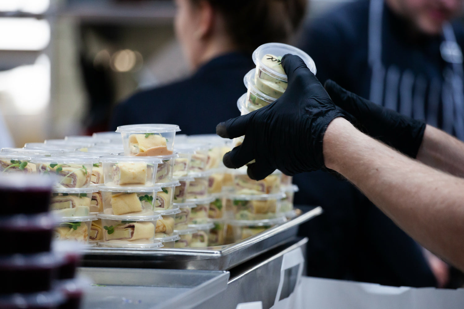 Food service worker distributing packaged food
