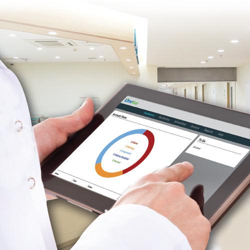 Person in lab coat holding tablet displaying OneVue dashboard